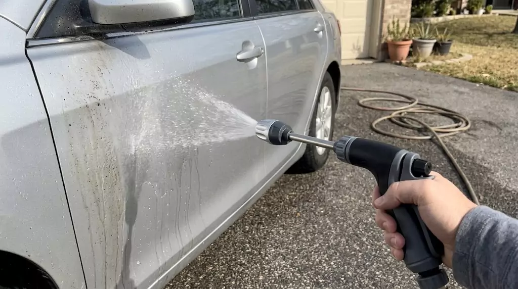 Jetterix Halo Nectar test on a silver family wagon — soft fan spray hitting the driver's door directly